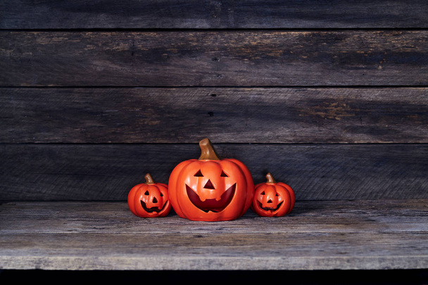 Halloween pumpkin lantern. Trick or treat on a wooden table - Fotografie, Obrázek