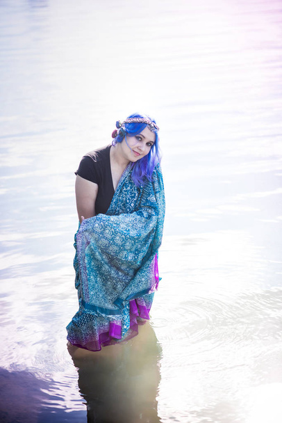 Girl in a sari near the lake - 写真・画像