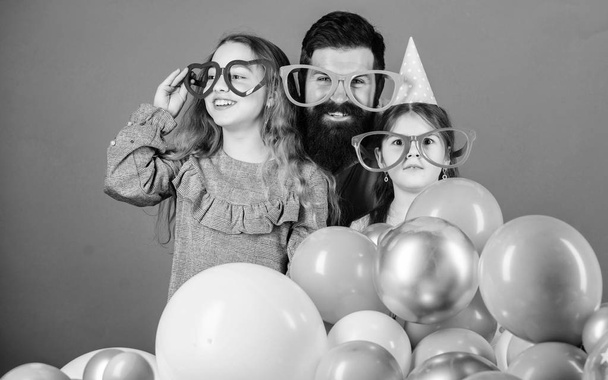 Birthday party. Father with two daughters having fun. Fatherhood concept. Friendly family wear funny party accessories. Best dad ever. Fathers day. Daughters need father actively interested in life - Photo, Image
