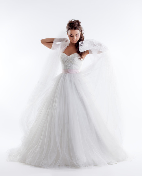 Pretty bride posing in stylish dress with veil - Zdjęcie, obraz
