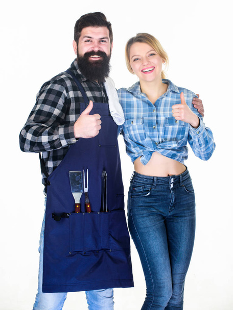 Tools for roasting meat. Family weekend. Man bearded hipster and girl. Preparation and culinary. Couple in love hold kitchen utensils. Picnic barbecue. food cooking recipe. Impossible choice - Foto, Imagen