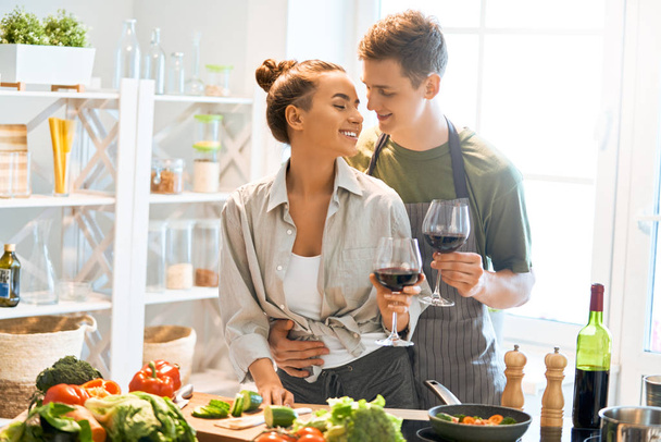 loving couple is preparing the proper meal - Фото, зображення