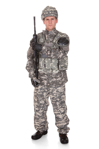Portrait Of Solider Holding Rifle - Foto, afbeelding