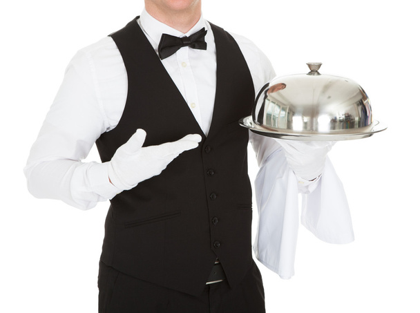 Waiter Holding Empty Silver Tray - Foto, afbeelding