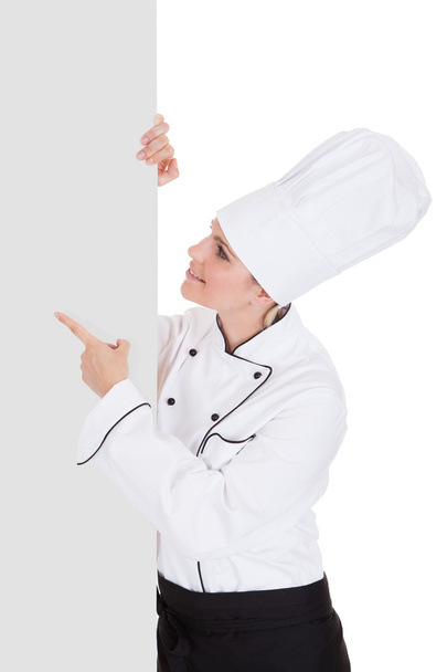 Chef femenino mostrando placa en blanco
 - Foto, Imagen