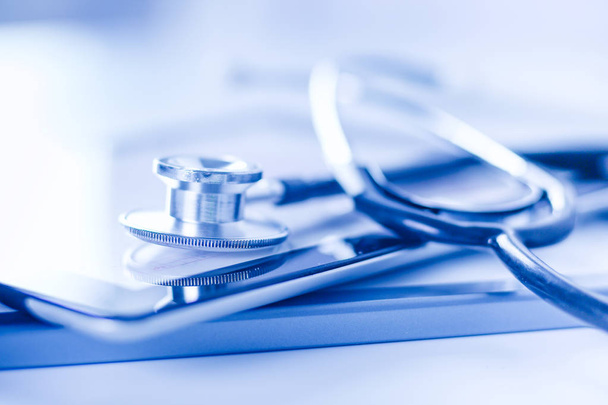 Medical equipment: stethoscope and tablet on white background. Medical equipment - Fotografie, Obrázek