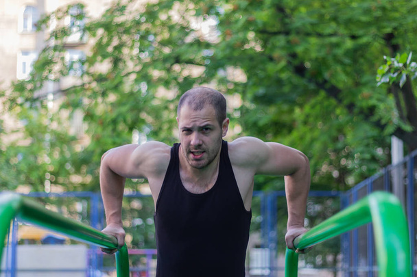 sport athlete doing exercise on uneven bars gym  lifestyle fitness - Fotoğraf, Görsel