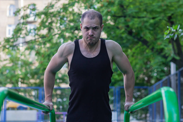 sport athlete doing exercise on uneven bars gym  lifestyle fitness - Valokuva, kuva