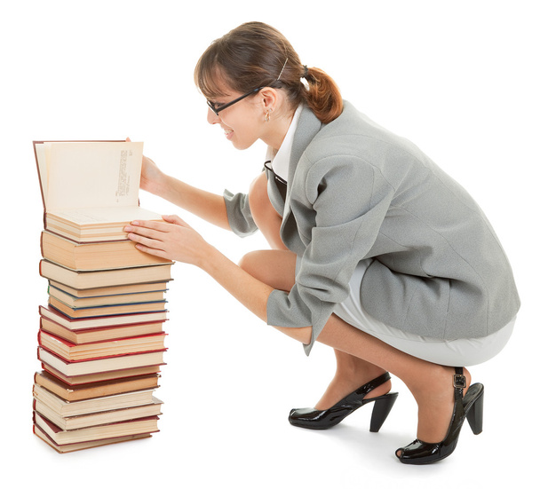 Woman and a pile of books - Foto, imagen