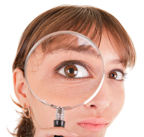 Woman and magnifier - 写真・画像