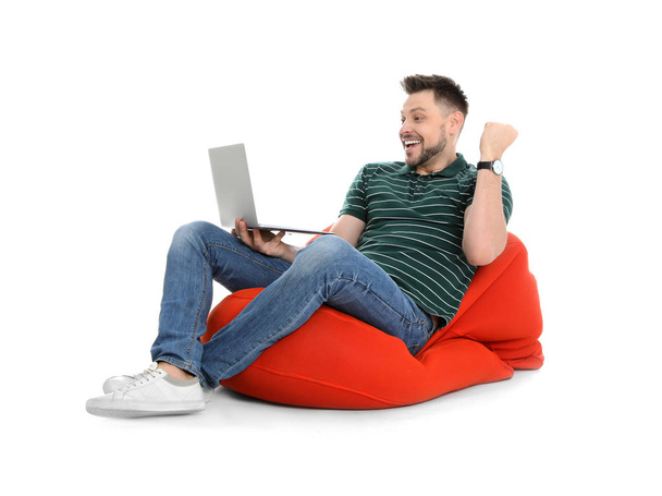 Emotional man with laptop on white background - Zdjęcie, obraz