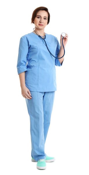 Full length portrait of experienced doctor in uniform on white background. Medical service - Photo, image