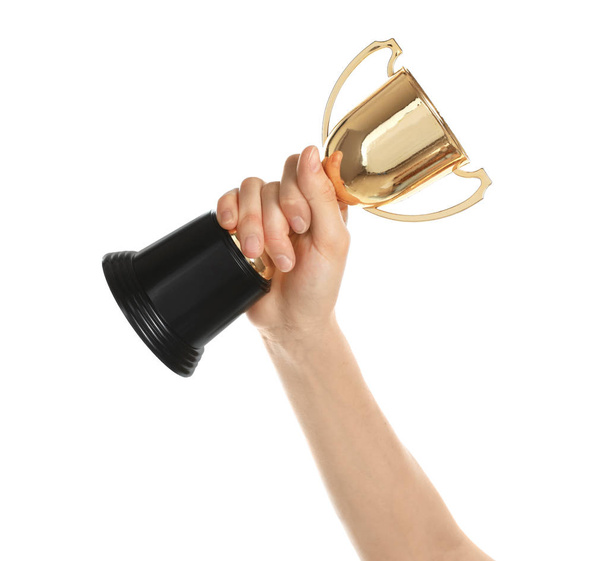 Young woman holding gold trophy cup on white background, closeup - Photo, Image