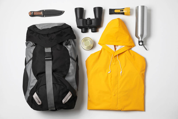 Flat lay composition with different camping equipment on white background - Fotografie, Obrázek