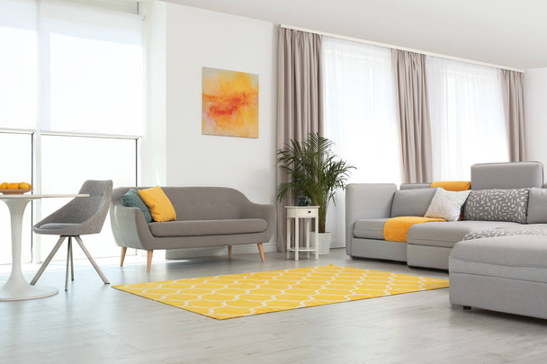 Living room with modern furniture and stylish decor. Color ideas for interior - Valokuva, kuva