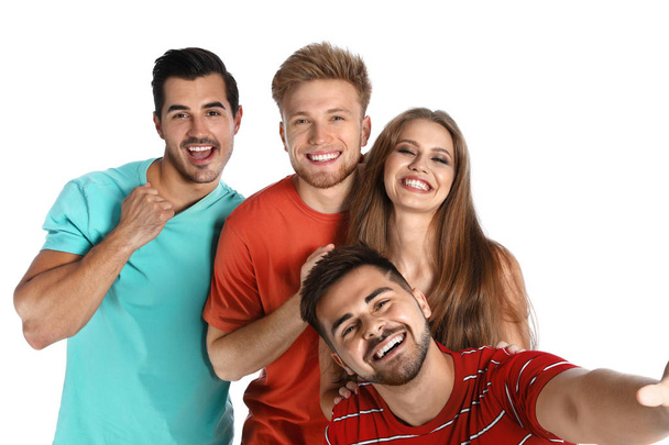 Happy young people taking selfie on white background - Foto, afbeelding