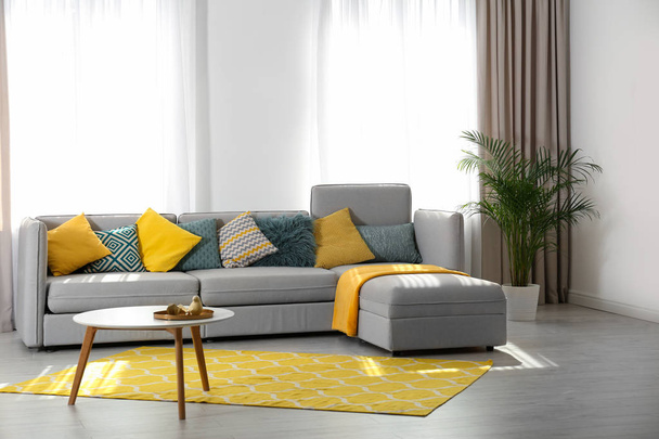 Stylish living room interior with comfortable sofa. Space for text - Fotó, kép