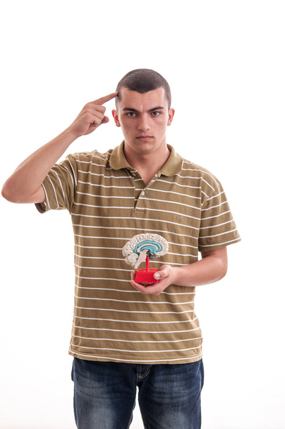 Man with a human brain model in his hand, points to the head, fr - Фото, зображення