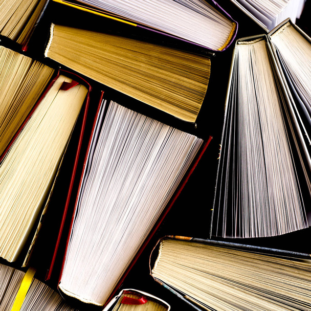 Sok színes vastag nyitott könyvek állni egy sötét háttér - Fotó, kép
