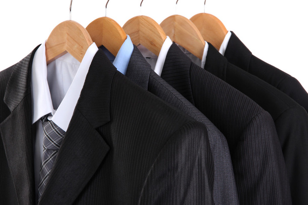 Suits with shirts on hangers on white background - Fotografie, Obrázek