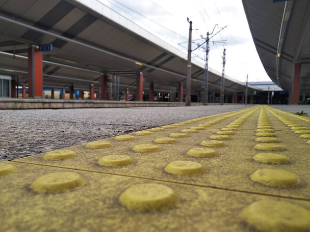 traffic safety for people with visual impairment. special equipment for the free movement of persons with disabilities. bright yellow tiles with tactile elements. - Photo, Image