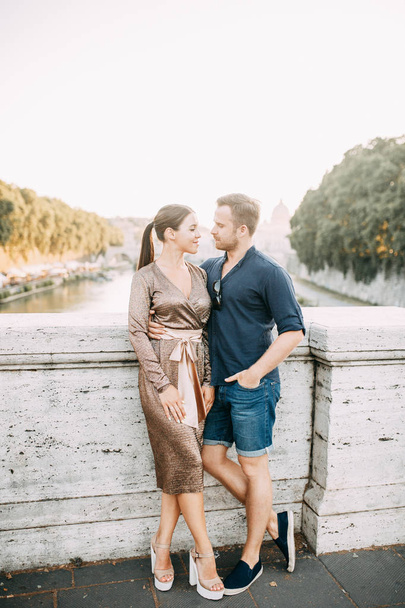 Happy couple at sunset in Italy. Evening summer photo shoot in Rome.  - Zdjęcie, obraz