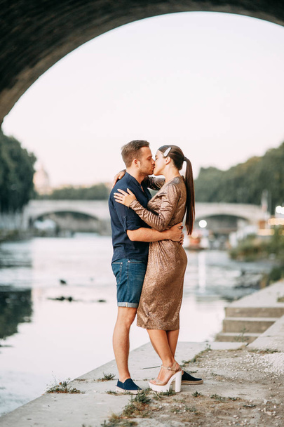 Happy couple at sunset in Italy. Evening summer photo shoot in Rome.  - Photo, Image