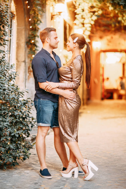 Happy couple at sunset in Italy. Evening summer photo shoot in Rome.  - Φωτογραφία, εικόνα
