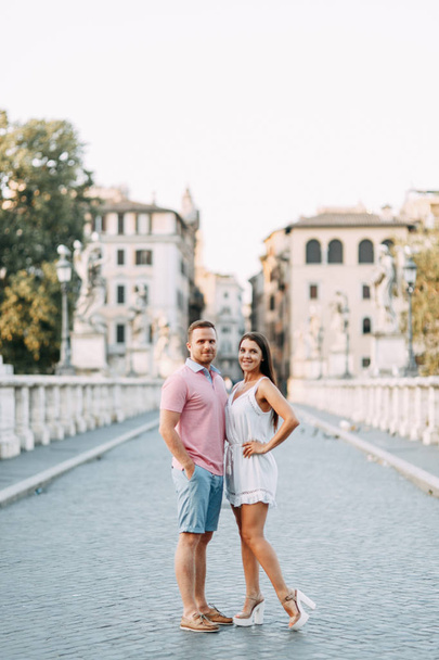 Happy couple at dawn strolling in Italy. Morning summer photo shoot in Rome.  - Фото, изображение