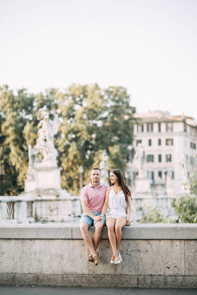 Happy couple at dawn strolling in Italy. Morning summer photo shoot in Rome.  - Фото, изображение