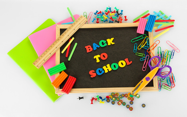 Small chalkboard with school supplies on white background. Back to School - Foto, Imagem