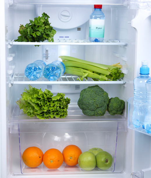 Open refrigerator with vegetarian food - Фото, зображення