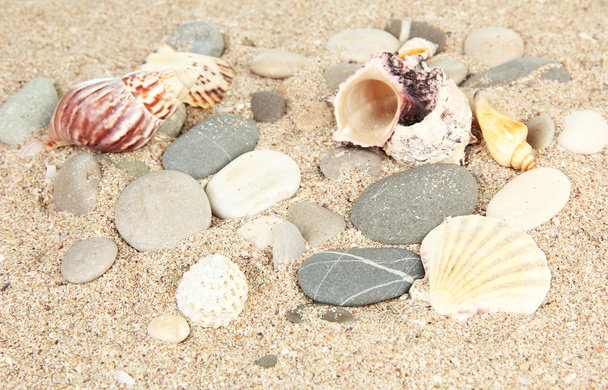 Sea stones on sand background - 写真・画像