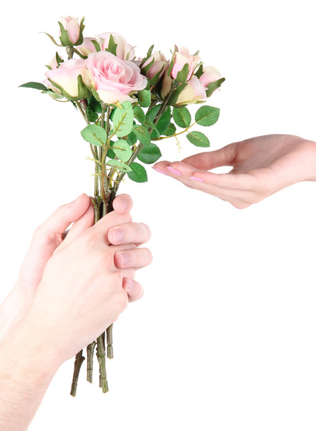 Man's hand giving a roses isolated on white - Fotoğraf, Görsel