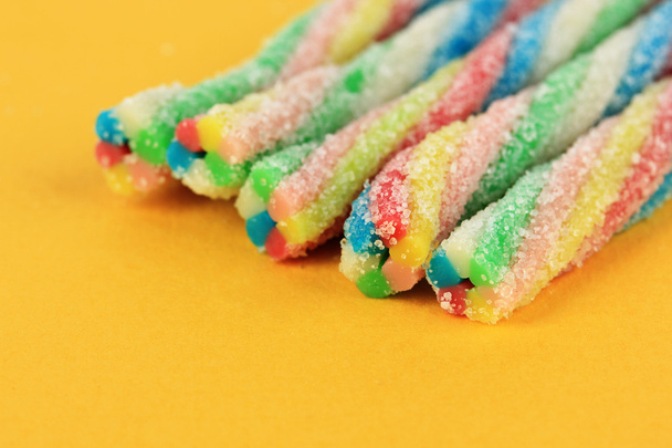 Sweet jelly candies on yellow background - Фото, зображення