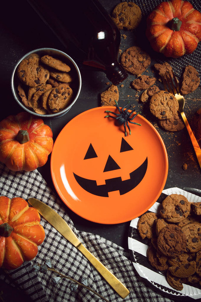 spooky cookies dessert with pumpkin dish halloween holiday dinner prop decoration with wood table background - Photo, image