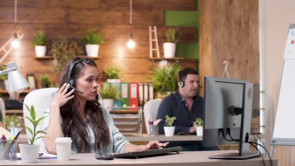 Customer service or sales operators working in a cozy office - Video, Çekim