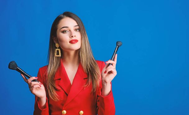 Perfect female. Fashion portrait of woman. beauty and fashion. hair beauty and hairdresser salon. jewelry earrings. Girl in red jacket. Sexy woman with professional makeup brush tool. copy space - Photo, Image