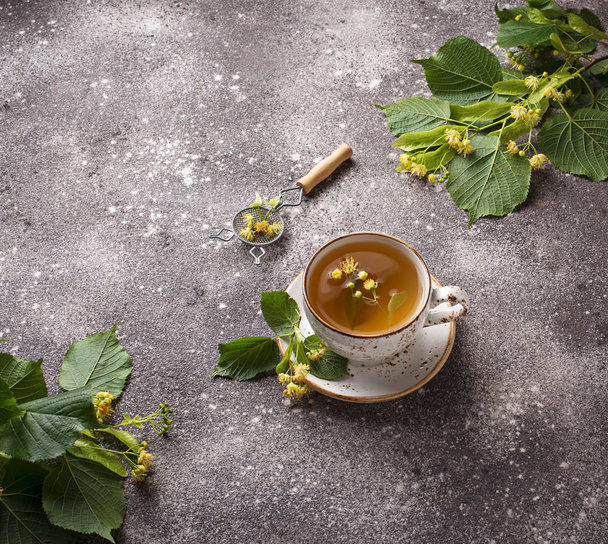 Healthy hot linden tea in cup - Photo, Image