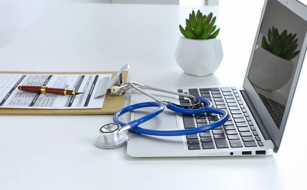 Stethoscope lying on a laptop keyboard in a concept of online m - Photo, Image