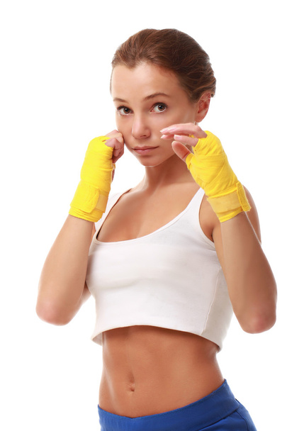 Young attractive fitness model in boxing bandages - 写真・画像