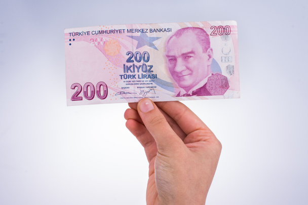 Ruku v ruce drží bankovka Turksh lir - Fotografie, Obrázek
