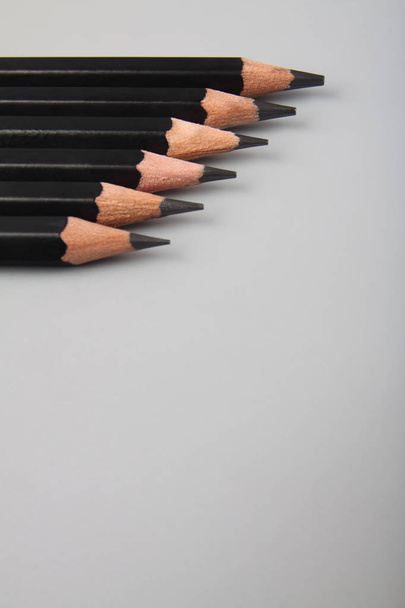 Black pencil on gray background - Foto, Imagem