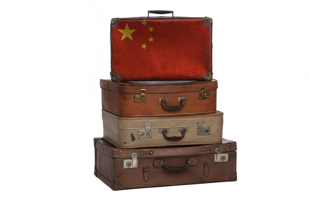 China, Chinese travel concept. Group of vintage suitcases isolated on white background. - 写真・画像
