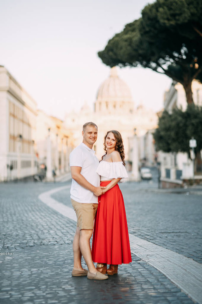 Stylish loving couple walking and laughing. Wedding shooting on the streets of Rome, Italy.  - Foto, imagen