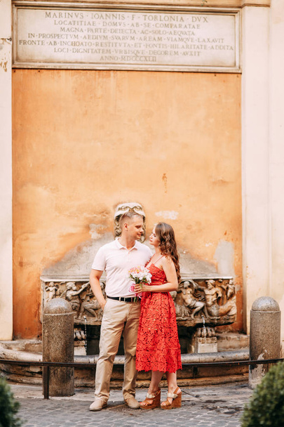 Stylish loving couple walking and laughing. Wedding shooting on the streets of Rome, Italy.  - Valokuva, kuva