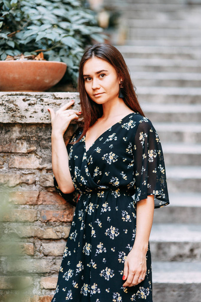 Travel blogger and sightseeing. Portraits of a beautiful girl on the streets of Rome.  - Photo, image