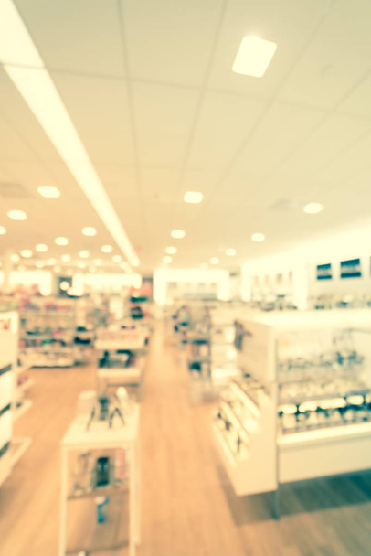 Filtered image blurry background cosmetics and makeup supplies at American beauty store - Photo, Image