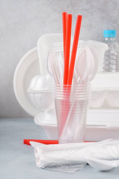 Set of white plastic disposable tableware and packaging. - Фото, изображение
