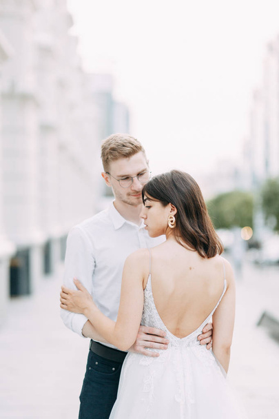 Couple on the streets. A stylish wedding in the European style of fine art. - Foto, Bild